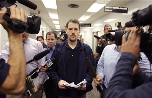 Josh Powell is surrounded by reporters as he leaves a Pierce County courtroom in Tacoma in September.