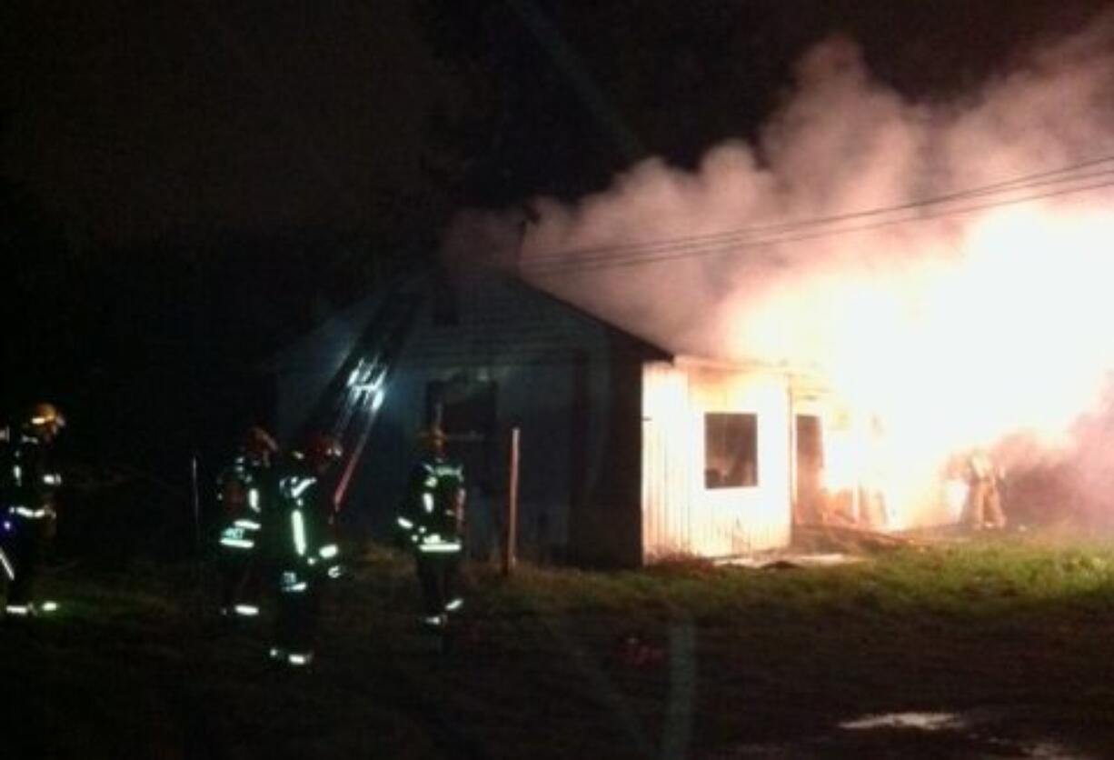 Vancouver firefighters battled a fire in an abandoned duplex in the Ogden neighborhood early Thursday.