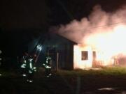 Vancouver firefighters battled a fire in an abandoned duplex in the Ogden neighborhood early Thursday.