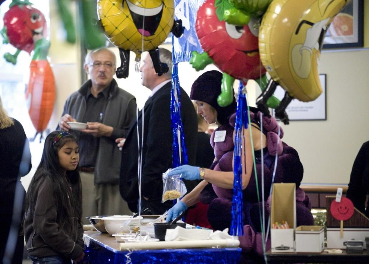 Holding a health fair, such as this one held last year at the Center for Community Health, is one step to setting up a workplace wellness program.