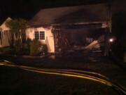 A garage fire damaged a house Saturday at 2020 S.E.