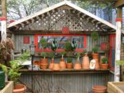 A bit of shabby chic adds interest to a utilitarian corner of the yard and garden.