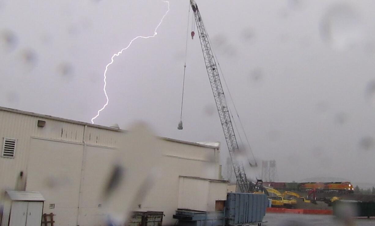 Lightning crackles through the skies above Vancouver on Saturday as a thunderstorm moved through.