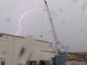 Lightning crackles through the skies above Vancouver on Saturday as a thunderstorm moved through.