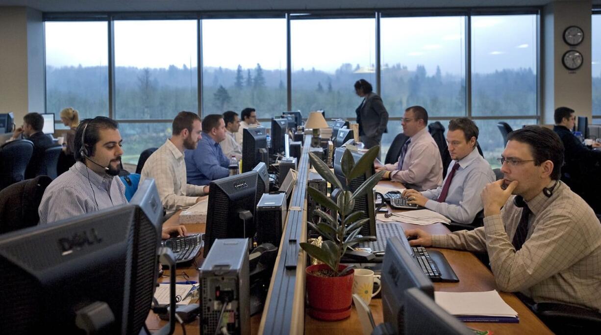 Money managers get to work inside the new Fisher Investments offices in December 2011