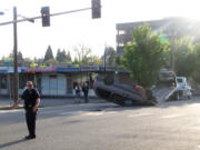 A flipped minivan blocked traffic at Mill Plain and C Street in downtown Vancouver Tuesday morning.