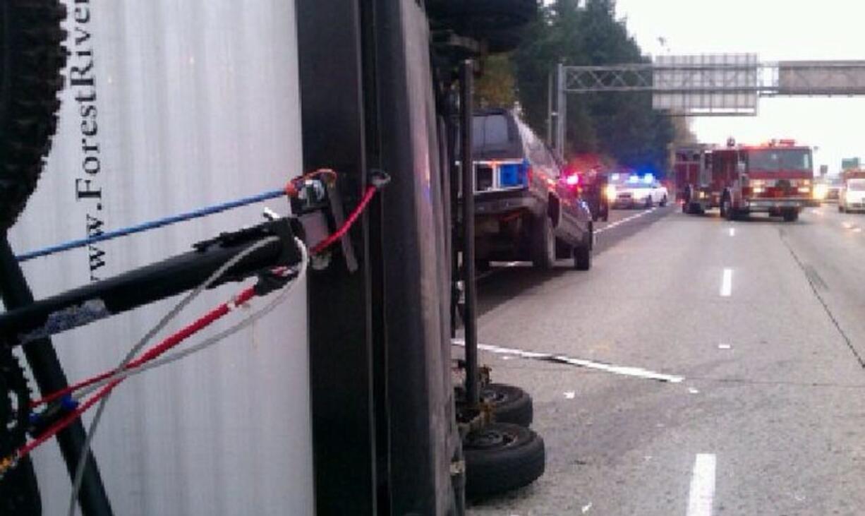 An SUV pulling a trailer flipped in the southbound lanes of Interstate 5 south of Northeast 179th Street on Tuesday afternoon.