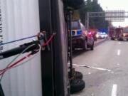 An SUV pulling a trailer flipped in the southbound lanes of Interstate 5 south of Northeast 179th Street on Tuesday afternoon.