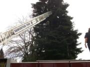 Firefighters with the Vancouver Fire Department helped two boys get out of a tree in the Sunnyside neighborhood Monday afternoon.