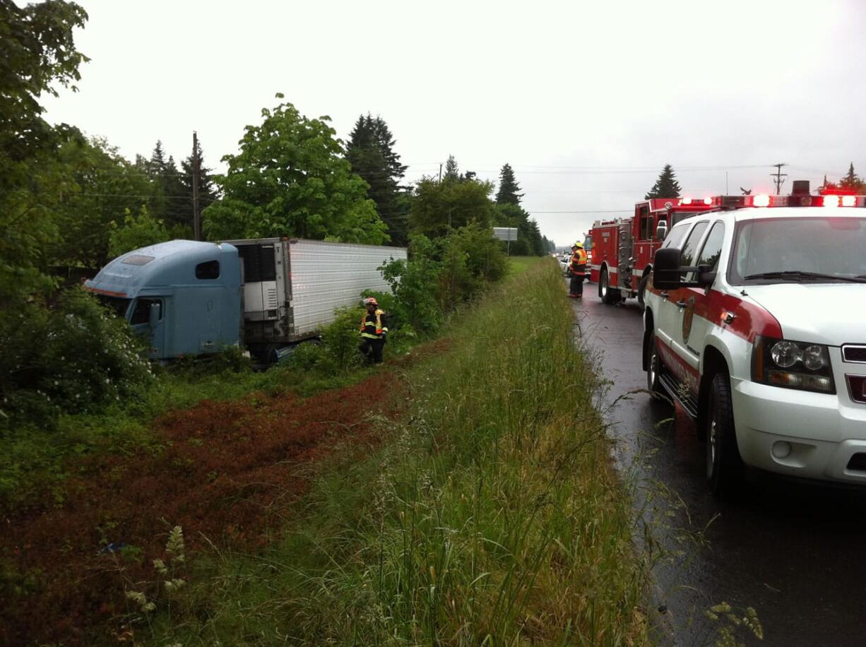 Vancouver firefighters responded Thursday morning after a tractor-trailer rig skidded off eastbound Highway 14 near the Southeast 164th Avenue exit.