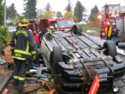 Firefighters responded to a rollover accident on the Interstate 5 south ramp to East Fourth Plain Boulevard on Monday afternoon.