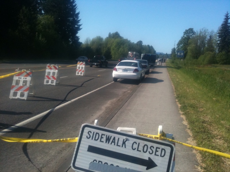 Police cordon off part of Southwest 10th Avenue in Battle Ground after the discovery of a woman's body in a ditch near the roadway.