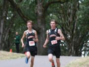 Washougal runners Sean Eustis (right) and Isaac Stinchfield (left) finished in fourth- and sixth-place at the Saxon Invitational Saturday, in Salem, Ore.