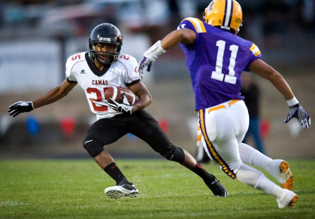 Camas High's Zack Marshall makes a move on Columbia River's Patrick Figueroa for extra yards in the first half at CRHS on Friday September 16, 2011.