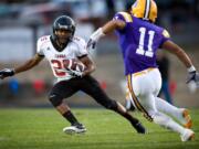 Camas High's Zack Marshall makes a move on Columbia River's Patrick Figueroa for extra yards in the first half at CRHS on Friday September 16, 2011.