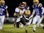 Prairie High School's Jesse Zalk, #80, makes a reception on the first play from scrimmage for a big gain to set up his team's first score against Columbia River, Friday, October 7, 2011.