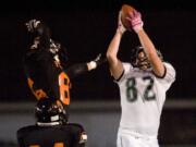 Woodland's Nick Fuller, #82, hauls in the game winning touchdown pass in overtime to beat Washougal 35-28 at Fishback Stadium in Washougal, Firday, October 14, 2011.