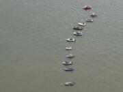 Boats fish for chinook just downstream of the mouth of the Cowlitz River last fall.