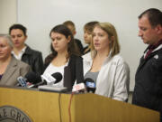 Olga Tupikova, center, and family members ask for the public's help finding out what happened to Tatyana Tupikova during a press conference at the Battle Ground Police Department on Friday.