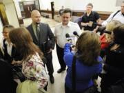 Tim Graf, the ex-husband of suspect Sandra Weller, talks with reporters this morning outside a courtroom.