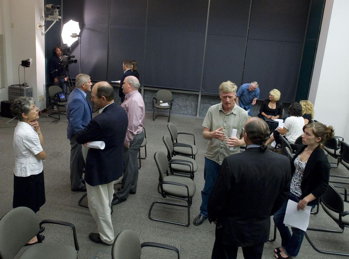 A sparse crowd gathered Tuesday evening on the sixth floor of the Public Service Center as the election results were released.