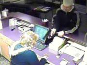 Vancouver police are asking for the public's help to identify a man who robbed a desk clerk at a hotel Wednesday night.