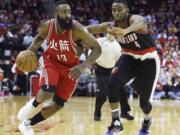 Houston Rockets&#039; James Harden (13) drives the ball past Portland Trail Blazers&#039; Maurice Harkless (4) in the second half of an NBA basketball game Saturday, Feb. 6, 2016, in Houston. Portland won 96-79.