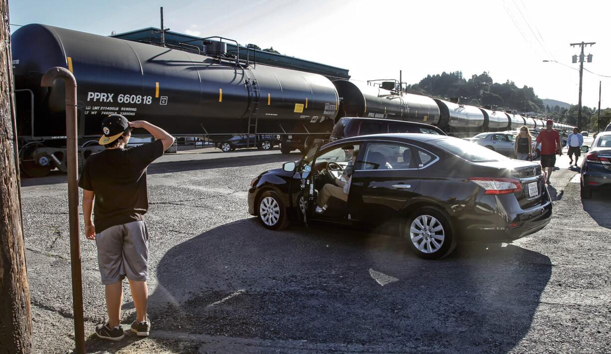 Oil trains, like this one passing through downtown Rainier, Ore., in 2014, no longer roll through Columbia County due to low crude prices.