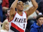 Portland Trail Blazers guard C.J. McCollum shoots against the Minnesota Timberwolves during the second half of an NBA basketball game in Portland, Ore., Sunday, Jan. 31, 2016. The Trail Blazers won 96-93.