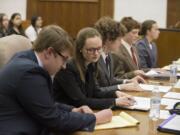 Camas High School students Bracy Ratcliff, 17, from left, Baylee Allen, 18, and Alex McOmie, 17, act as defense attorneys during Clark County&#039;s district mock trial tournament on Thursday afternoon at the Clark County Courthouse. The Camas team is eligible to compete in the state mock trial tournament in Olympia next month.