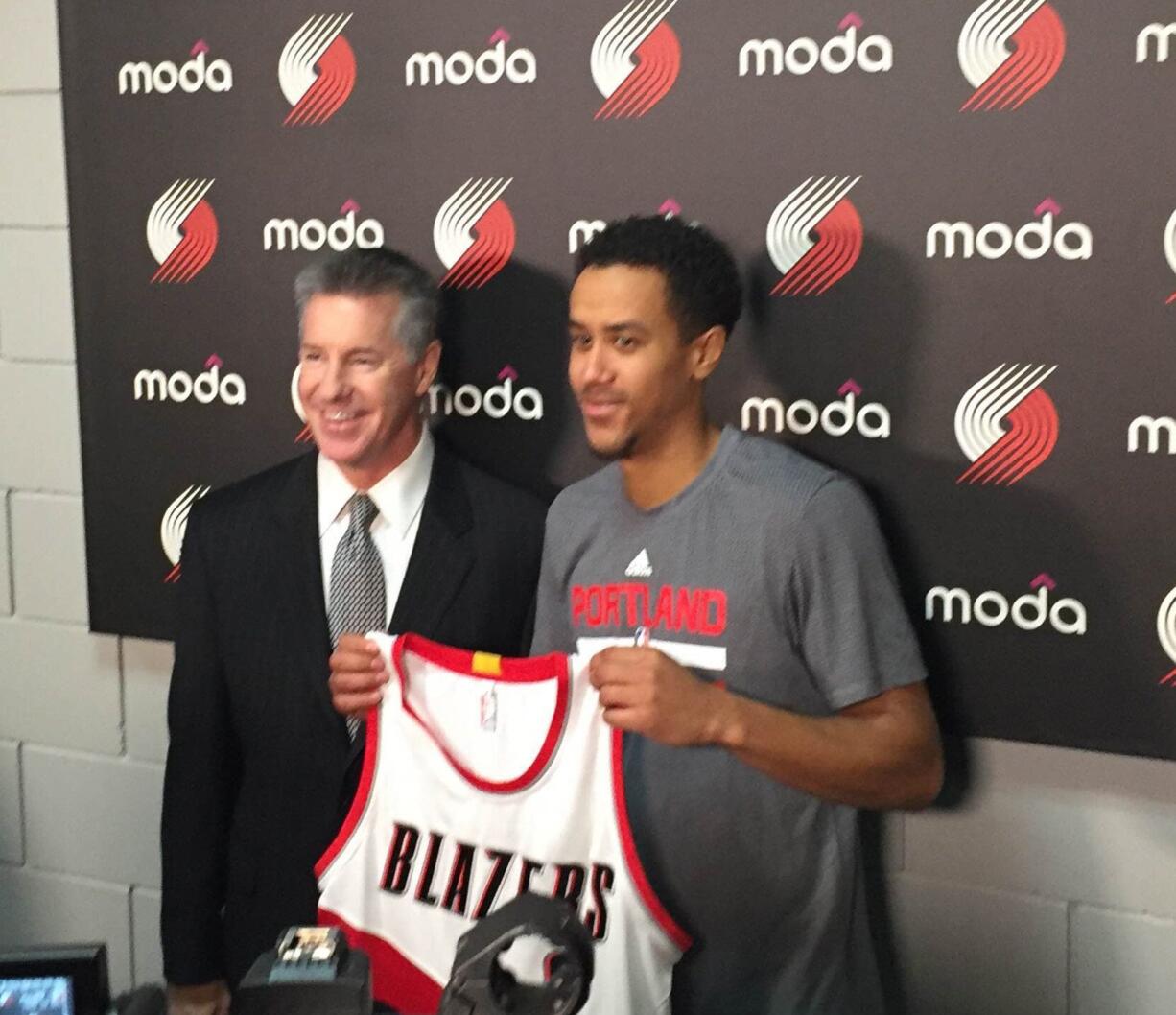 New Portland Trail Blazer Brian Roberts alongside Portland President of Basketball Operations Neil Olshey.