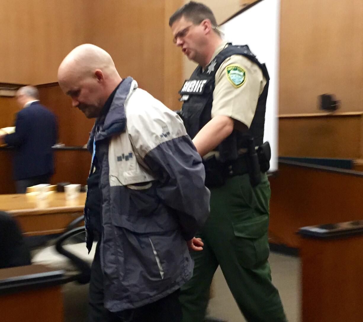 Ronald Ahlquist is taken into custody following his jury trial in January after being found guilty of manslaughter, identity theft and theft. He was sentenced Tuesday to 110 months in prison.