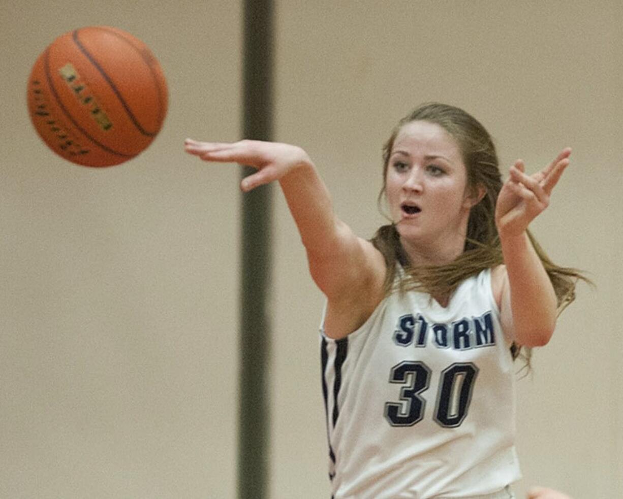 Skyview's Ashlee Comastro (30) passes to a teammate after recovering a loose ball in the first quarter Tuesday evening, Feb. 16, 2016 at Battle Ground High School.