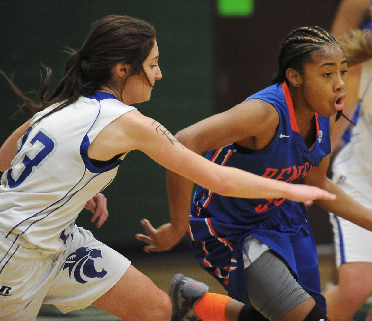 La Center player Andrea Griffee (L) and Shelby Vermeulen (R)  pursue  Benson's Janae Brown (C) at a girls basketball game at Evergreen High School in Vancouver Monday December 28, 2015.