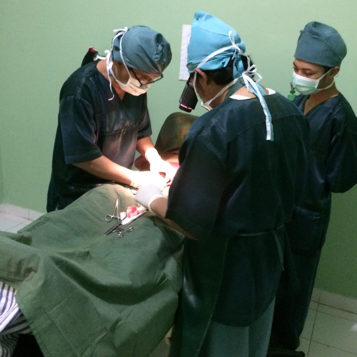 A team of doctors perform a vasectomy at the Nur Hidayah medical clinic outside Yogyakarta, Indonesia. Like many religiously affiliated medical providers in Indonesia, the clinic offers extensive family planning services, including providing contraceptives and performing sterilizations. (Noam N.