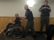 Douglas Atkins used a wheelchair for his first court appearance in December after a car chase that ended with a crash. He was sentenced Friday to more than two years in prison.