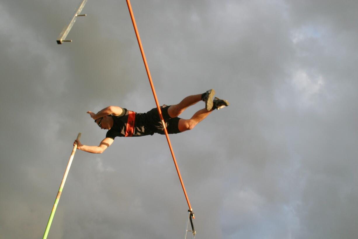 Brendan Casey soars over the bar set at 14 feet, 6 inches to become the new school record holder in the pole vault.