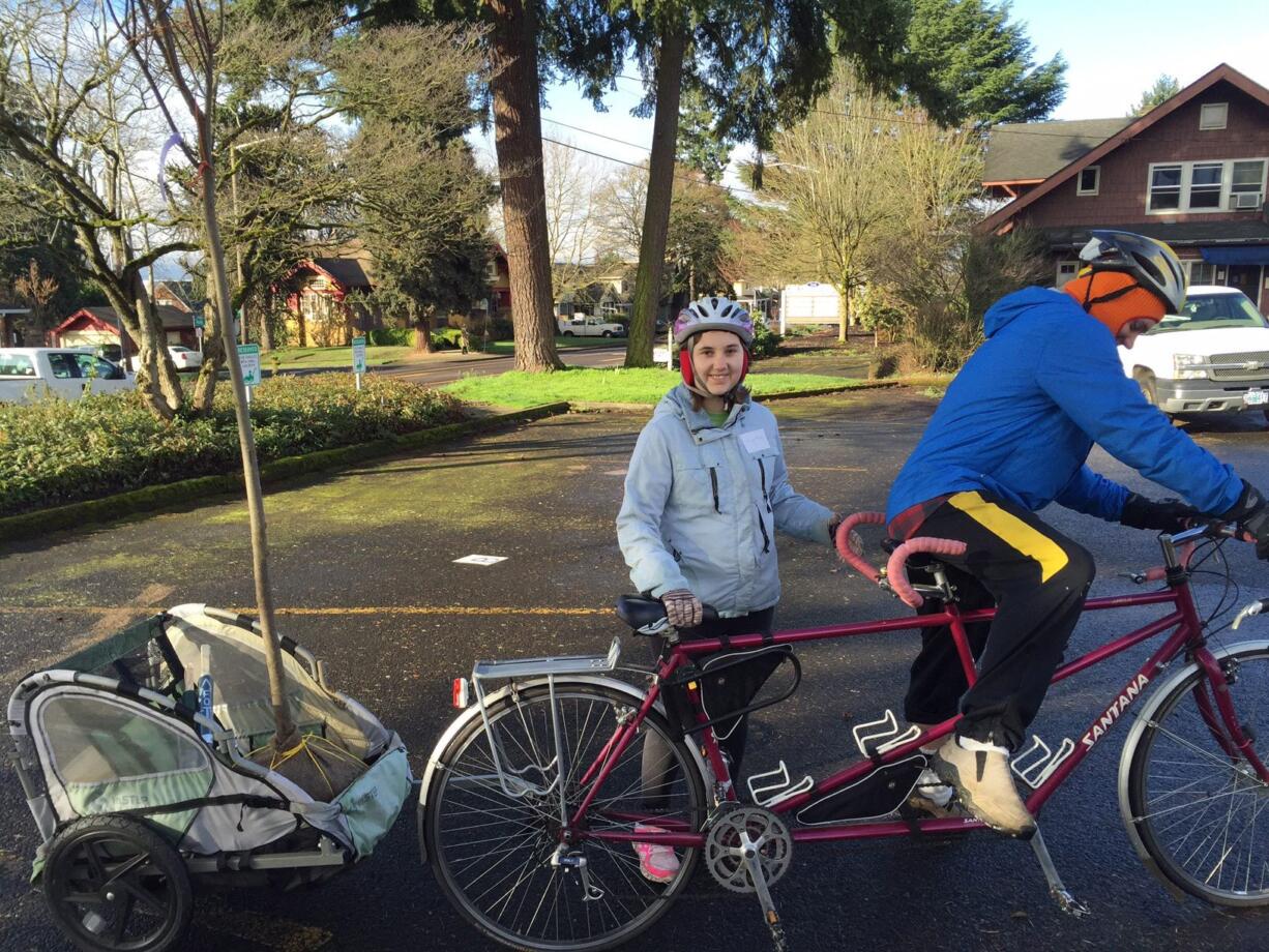 Shumway Neighborhood: From left, Harley and Courtney Forbes prepare to plant trees by bike.