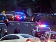 People are evacuated from the Center for Community Health after reports of shots fired on Feb. 4, 2014, at the Vancouver VA campus. A man shot in the incident is suing the county.