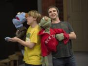 Not quite Bert and Ernie, but almost: Philip Graves, left, as closeted Rod and Tristan Colo as cheerful Nicky rehearse for the opening of &quot;Avenue Q&quot; at Clark College.