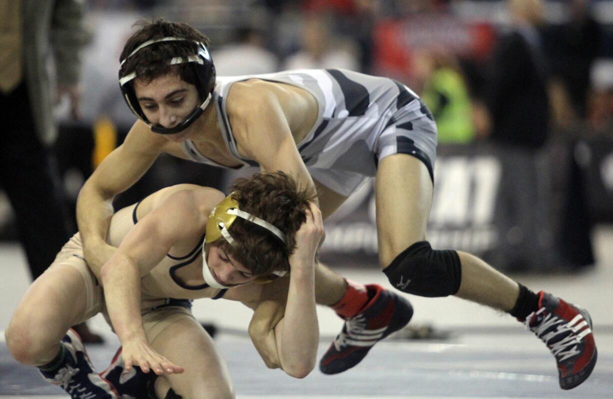 Union's Ethan Rotondo takes down Meads' Chase Tebbets in their 106 pound match on Saturday, February 19, 2016 at the Mat Classic XXVIII Championship matches held in the Tacoma Dome. Rotondo went on to take the championship with a 9-5 win.