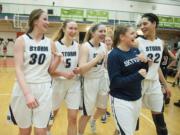 Members of the Skyview girls basketball team celebrate after their win over Camas Tuesday evening, Feb. 16, 2016 at Battle Ground High School.