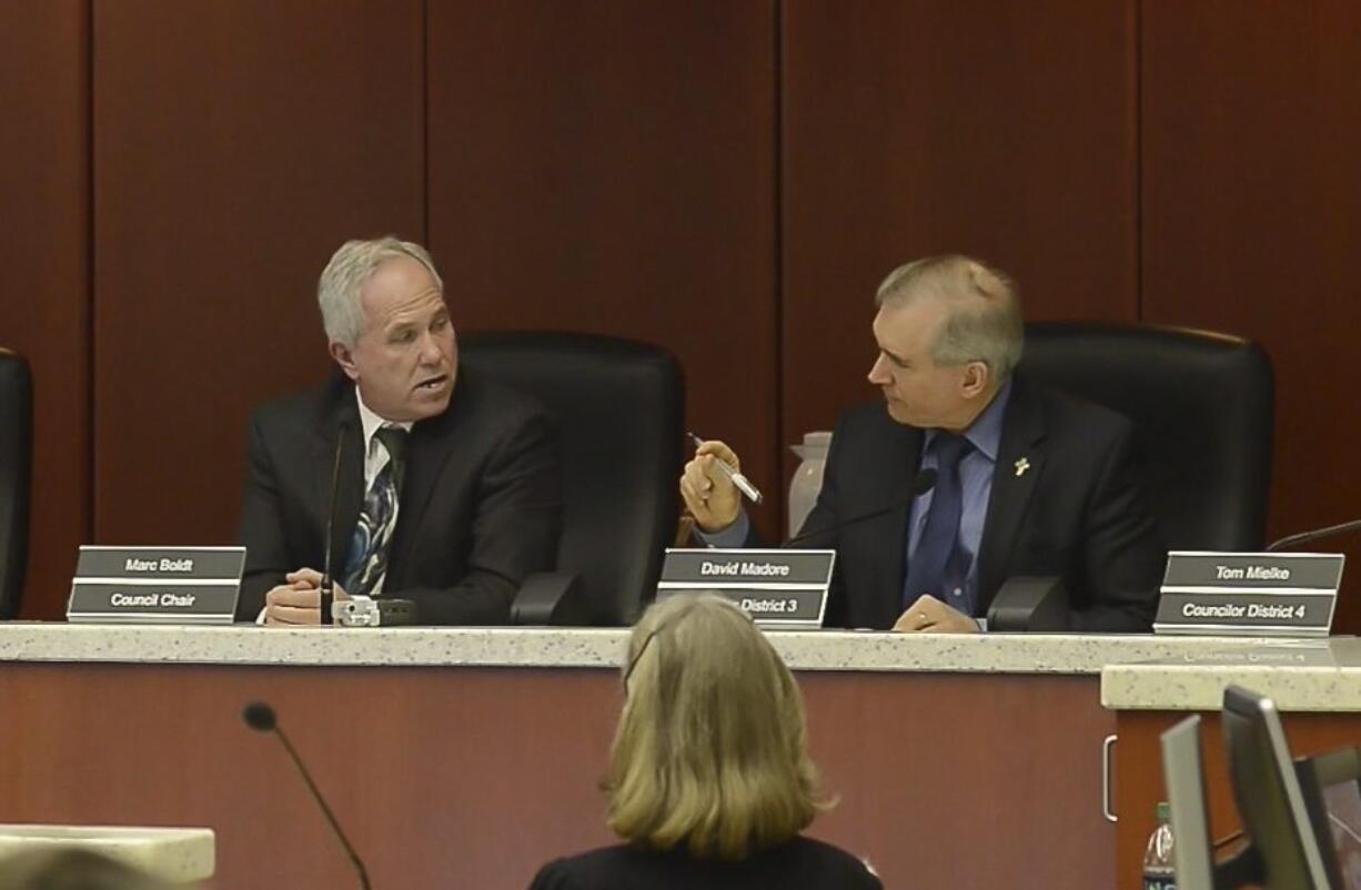 Councilor David Madore, right, lectures Chair Marc Boldt about appropriate emotions.