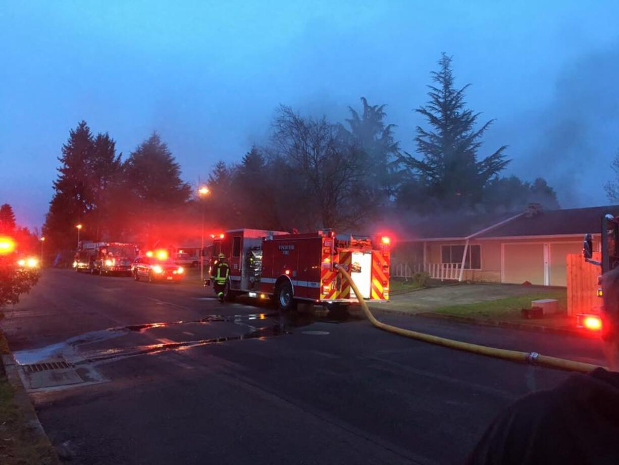 Firefighters respond to a fire that spread from a kitchen to the rest of the home Tuesday evening in east Vancouver.