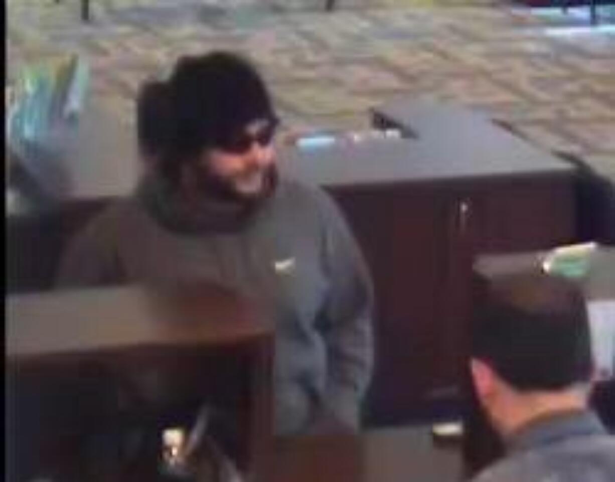 Police are seeking this man in connection with a Friday robbery at an Umpqua Bank branch in Hazel Dell.(Clark County Sheriff's Office)