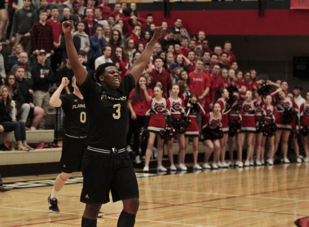 Evergreen guard Tyrus Hosley celebrates win against Camas.