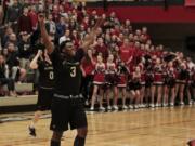 Evergreen guard Tyrus Hosley celebrates win against Camas.