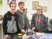 Woodland: Members of the Woodland Middle School Lego Robotics Class Ole Warndahl, from left, Aaron Shaw and Ashley Burney on a field trip to tour University of Washington&#039;s three-dimensional printer research lab.