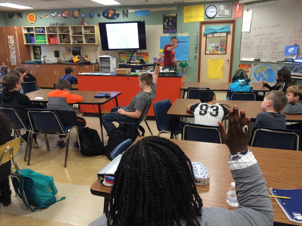 Washougal: Jeremy Fick, a civil engineer from Robertson Engineering in Vancouver, talking to Jemtegaard Middle School sixth-graders about his work in designing a new school being built near the middle school.