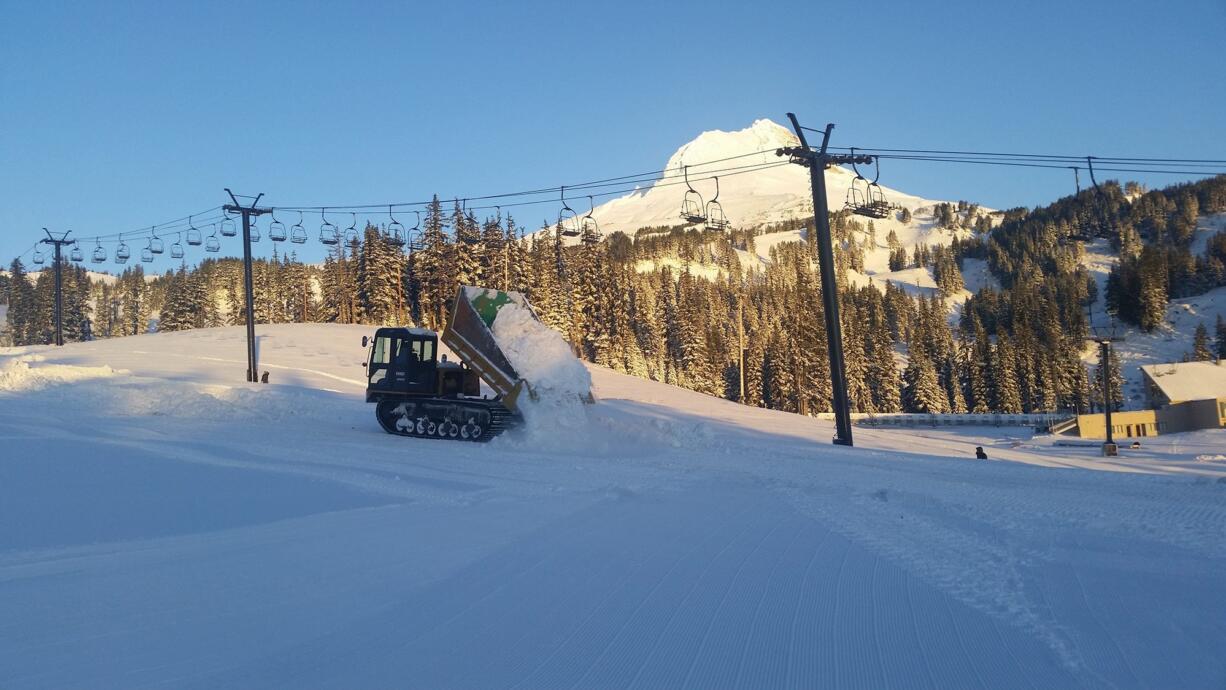 Crews at Mount Hood Meadows pad the slopes at lower elevations to make them skiable sooner.